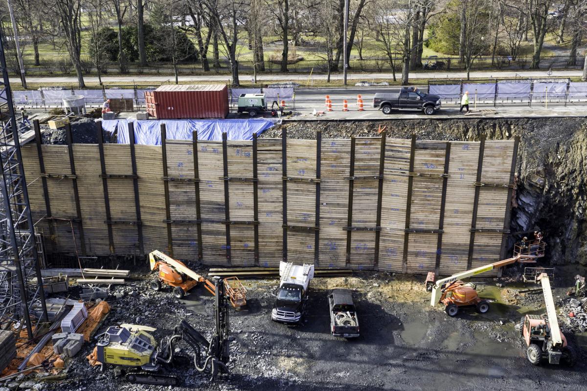 Large wooden retaining wall shoring a steep hillside